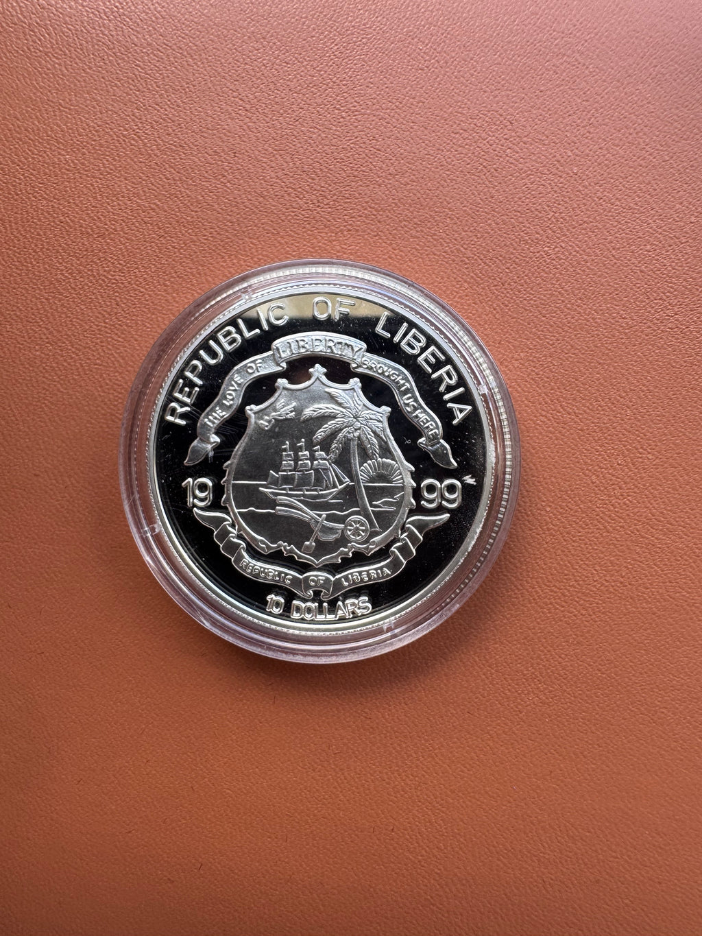 Awers – Republic of Liberia 1999, herb, The Love of Liberty Brought Us Here, 10 Dollars